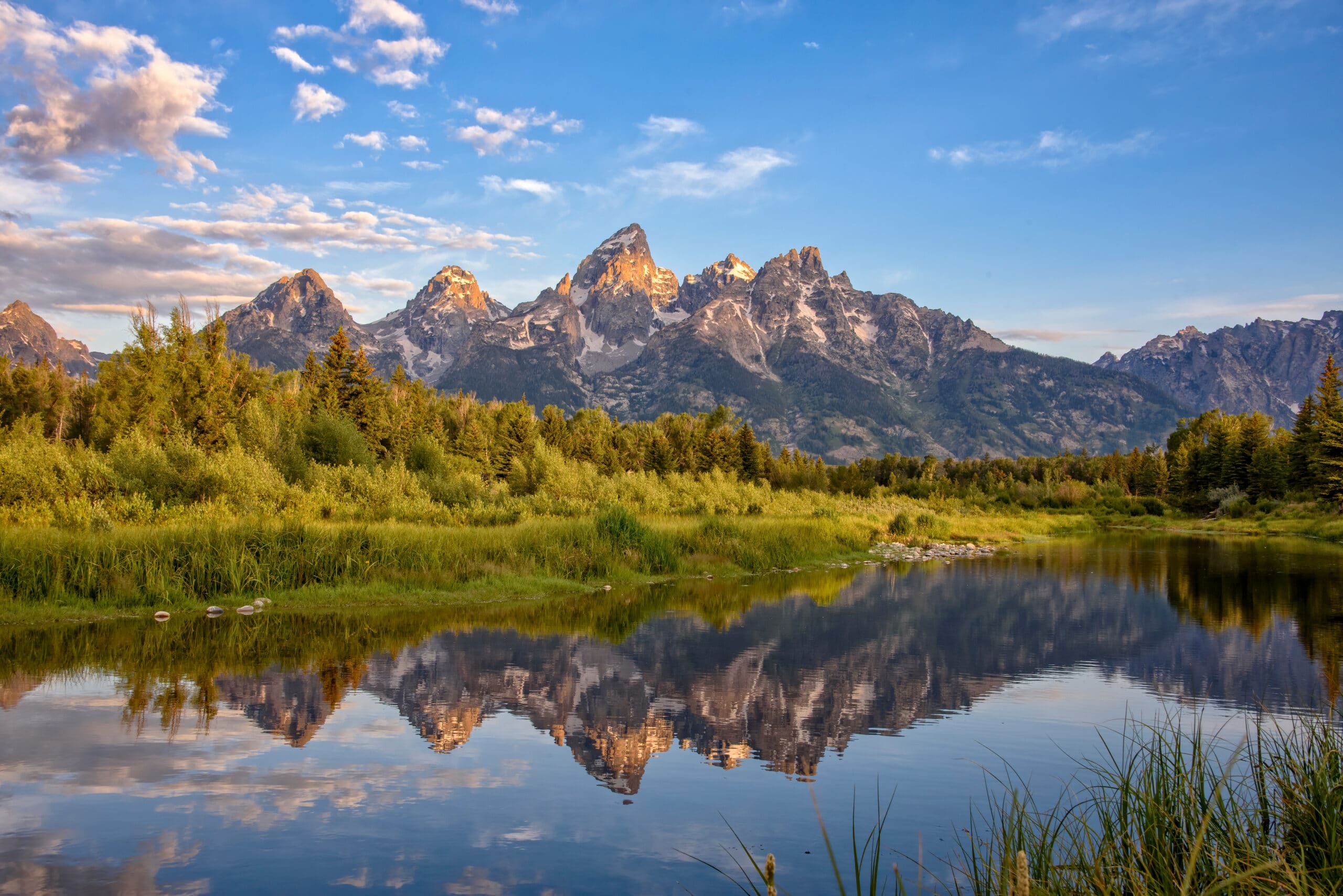 Schwabacher's Landing, Jackson Hole, Wyoming. The Grand Teton mountains are seen at dawn reflected in the still water of the Snake River