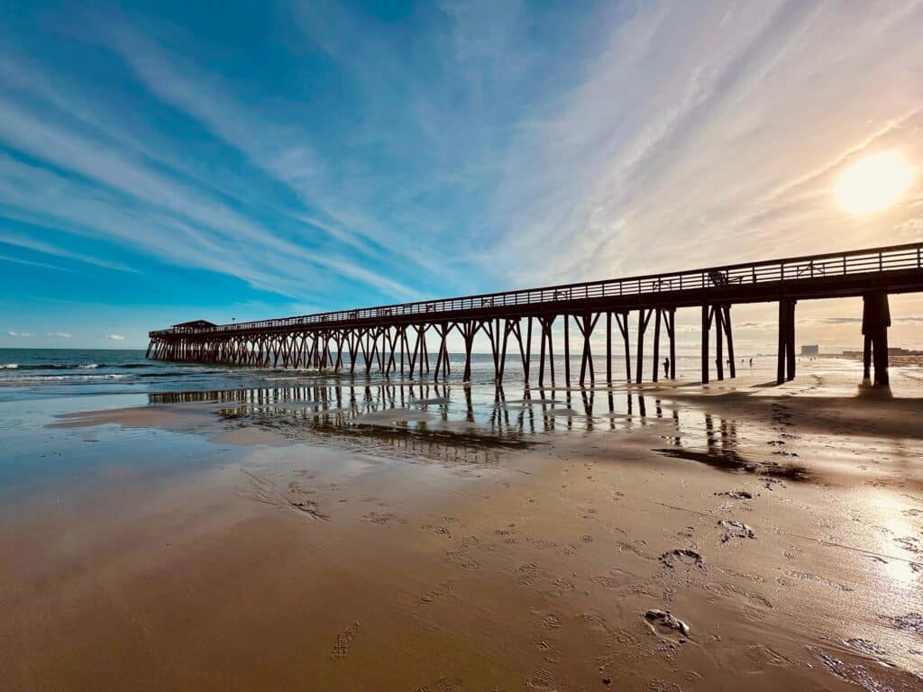 Wooden pier into ocean in the Myrtle Beach State Park, Horry County, South Carolina