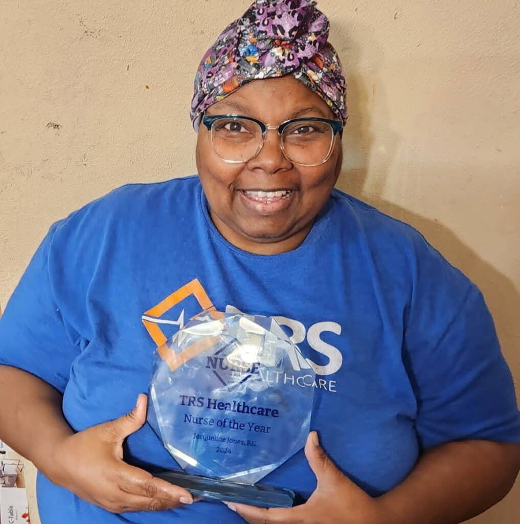 TRS Healthcare travel nurse and 2024 Nurse of the Year recipient Jacqueline Jones, RN, with her trophy
